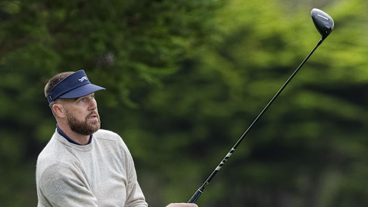 February 13, 2026; Pebble Beach, California, USA; Kansas City Chiefs tight end Travis Kelce hits his tee shot on the third hole during the second round of the AT&T Pebble Beach Pro-Am golf tournament at Pebble Beach Golf Links. Mandatory Credit: Kyle Terada-Imagn Images