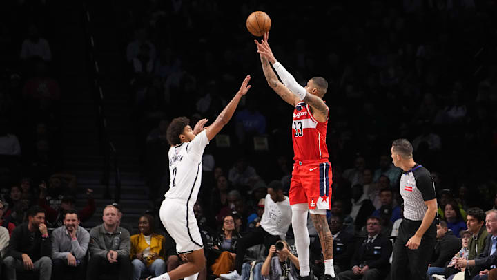 Oct 14, 2024; Brooklyn, New York, USA; Washington Wizards small forward Kyle Kuzma (33) shoots a three-point jump shot over Brooklyn Nets small forward Cameron Johnson (2) during the first half at Barclays Center. Mandatory Credit: Gregory Fisher-Imagn Images Oct 14, 2024; Brooklyn, New York, USA; Washington Wizards small forward Kyle Kuzma (33) shoots a three-point jump shot over Brooklyn Nets small forward Cameron Johnson (2) during the first half at Barclays Center. Mandatory Credit: Gregory Fisher-Imagn Images