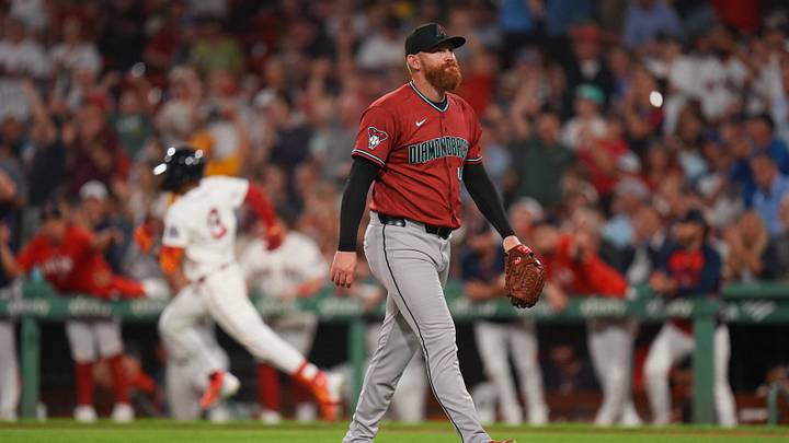 Aug 17, 2026; Boston, Massachusetts, USA; Arizona Diamondbacks pitcher Zack Littell (46) reacts after a double by Boston Red Sox center fielder Ceddanne Rafaela (3) to drive in a run in the fourth inning at Fenway Park. Mandatory Credit: David Butler II-Imagn Images