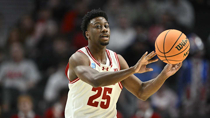 Mar 19, 2026; Portland, OR, USA; Wisconsin Badgers guard John Blackwell (25) passes against the High Point Panthers during the first half of a first round game of the men's 2026 NCAA Tournament at Moda Center. Mandatory Credit: Craig Strobeck-Imagn Images