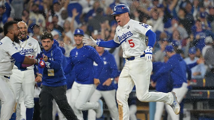 Oct 27, 2025; Los Angeles, California, USA; Los Angeles Dodgers first baseman Freddie Freeman (5) celebrates with teammates after hitting a walk off home run against the Toronto Blue Jays in the eighteenth inning during game three of the 2025 MLB World Series at Dodger Stadium. Mandatory Credit: Jayne Kamin-Oncea-Imagn Images