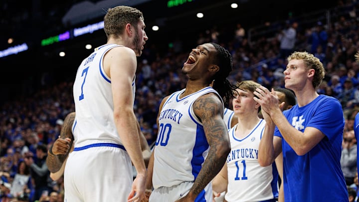 Jan 14, 2025; Lexington, Kentucky, USA; Kentucky Wildcats guard Otega Oweh (00) celebrates with forward Andrew Carr (7) after Carr scores a basket and foul during the second half against the Texas A&M Aggies at Rupp Arena at Central Bank Center. Mandatory Credit: Jordan Prather-Imagn Images