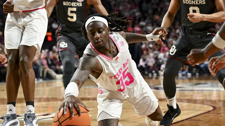 Jan 28, 2025; College Station, Texas, USA; Texas A&M Aggies guard Manny Obaseki (35) dives for a loose ball during the second half against the Oklahoma Sooners at Reed Arena. The Aggies defeated the Sooners 75-68. Mandatory Credit: Maria Lysaker-Imagn Images 