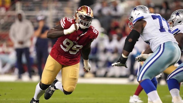 Oct 8, 2023; Santa Clara, California, USA; San Francisco 49ers defensive tackle Javon Kinlaw (99) rushes against Dallas Cowboys offensive tackle Tyron Smith (left) during the fourth quarter at Levi's Stadium.