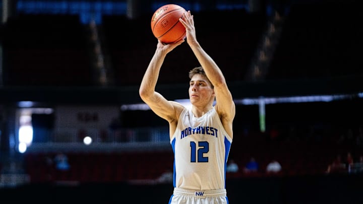 Waukee Northwest's Peyton McCollum (12) shoots a three pointer against Cedar Rapids Kennedy on Monday, March 10, 2025, at Wells Fargo Arena in Des Moines.
