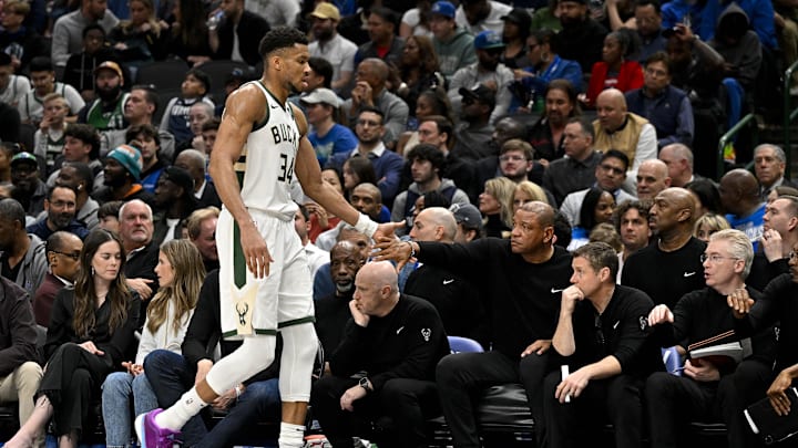 Feb 3, 2024; Dallas, Texas, USA; Milwaukee Bucks head coach Doc Rivers slaps the hand of forward Giannis Antetokounmpo (34) as he walks off the court during the second quarter at the American Airlines Center. Mandatory Credit: Jerome Miron-Imagn Images Feb 3, 2024; Dallas, Texas, USA; Milwaukee Bucks head coach Doc Rivers slaps the hand of forward Giannis Antetokounmpo (34) as he walks off the court during the second quarter at the American Airlines Center. Mandatory Credit: Jerome Miron-Imagn Images