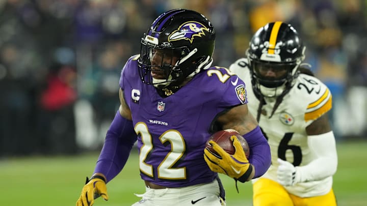 Jan 11, 2025; Baltimore, Maryland, USA; Baltimore Ravens running back Derrick Henry (22) runs against the Pittsburgh Steelers in the first quarter in an AFC wild card game at M&T Bank Stadium. Mandatory Credit: Mitch Stringer-Imagn Images