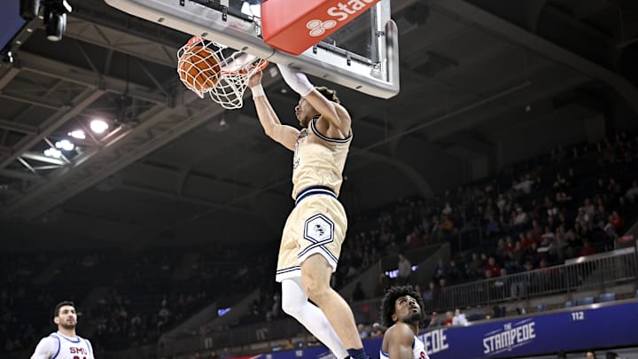 Jan 11, 2025; Dallas, Texas, USA; Georgia Tech Yellow Jackets guard Lance Terry (0) dunks the ball against the SMU Mustangs during the second half at Moody Coliseum. Mandatory Credit: Jerome Miron-Imagn Images Jan 11, 2025; Dallas, Texas, USA; Georgia Tech Yellow Jackets guard Lance Terry (0) dunks the ball against the SMU Mustangs during the second half at Moody Coliseum. Mandatory Credit: Jerome Miron-Imagn Images