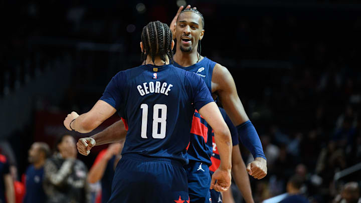 Mar 5, 2025; Washington, District of Columbia, USA; Washington Wizards forward Alex Sarr (20) celebrates with forward Kyshawn George (18) during the fourth quarter against the Utah Jazz at Capital One Arena. Mandatory Credit: Reggie Hildred-Imagn Images