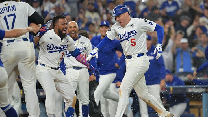 Oct 27, 2025; Los Angeles, California, USA; Los Angeles Dodgers first baseman Freddie Freeman (5) celebrates with teammates after hitting a walk off home run against the Toronto Blue Jays in the eighteenth inning during game three of the 2025 MLB World Series at Dodger Stadium. Mandatory Credit: Jayne Kamin-Oncea-Imagn Images Oct 27, 2025; Los Angeles, California, USA; Los Angeles Dodgers first baseman Freddie Freeman (5) celebrates with teammates after hitting a walk off home run against the Toronto Blue Jays in the eighteenth inning during game three of the 2025 MLB World Series at Dodger Stadium. Mandatory Credit: Jayne Kamin-Oncea-Imagn Images