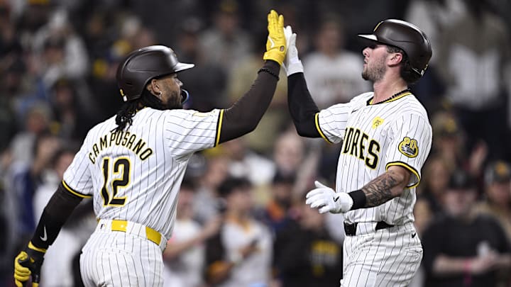 May 13, 2024; San Diego, California, USA; San Diego Padres center fielder Jackson Merrill (right) is congratulated by catcher Luis Campusano (12) after hitting a home run during the seventh inning against the Colorado Rockies at Petco Park. Mandatory Credit: Orlando Ramirez-Imagn Images