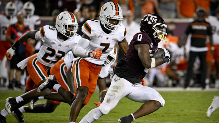 Sep 17, 2022; College Station, Texas, USA; Texas A&M Aggies wide receiver Ainias Smith (0) and Miami Hurricanes cornerback Al Blades Jr. (7) in action during the game between the Texas A&M Aggies and the Miami Hurricanes at Kyle Field. Mandatory Credit: Jerome Miron-Imagn Images Sep 17, 2022; College Station, Texas, USA; Texas A&M Aggies wide receiver Ainias Smith (0) and Miami Hurricanes cornerback Al Blades Jr. (7) in action during the game between the Texas A&M Aggies and the Miami Hurricanes at Kyle Field. Mandatory Credit: Jerome Miron-Imagn Images