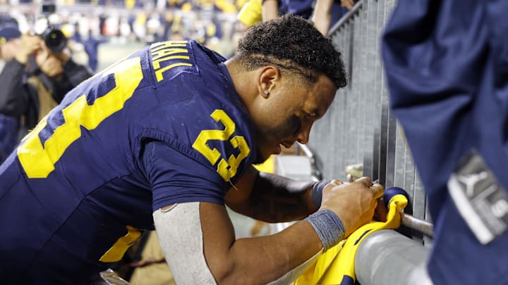 Nov 1, 2025; Ann Arbor, Michigan, USA;  Michigan Wolverines running back Jordan Marshall (23) signs an autograph after the game against the Purdue Boilermakers at Michigan Stadium. Mandatory Credit: Rick Osentoski-Imagn Images