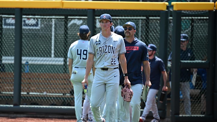 Jun 15, 2025; Omaha, Neb, USA;  Arizona Wildcats starting pitcher Smith Bailey (22) walks to the dugout before the game against the Louisville Cardinals at Charles Schwab Field. Mandatory Credit: Steven Branscombe-Imagn Images