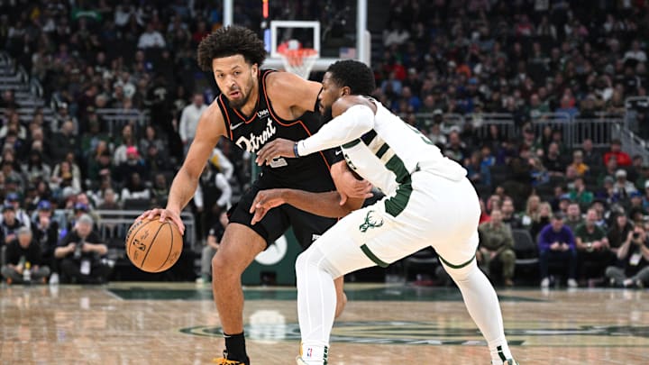 Nov 8, 2023; Milwaukee, Wisconsin, USA; Detroit Pistons guard Cade Cunningham (2) drives against Milwaukee Bucks guard Malik Beasley (5) in the first half at Fiserv Forum. Mandatory Credit: Michael McLoone-Imagn Images