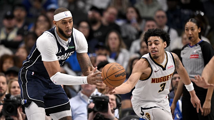 Jan 12, 2025; Dallas, Texas, USA; Dallas Mavericks center Daniel Gafford (21) and Denver Nuggets guard Julian Strawther (3) battle for the loose ball during the second half at the American Airlines Center. Mandatory Credit: Jerome Miron-Imagn Images Jan 12, 2025; Dallas, Texas, USA; Dallas Mavericks center Daniel Gafford (21) and Denver Nuggets guard Julian Strawther (3) battle for the loose ball during the second half at the American Airlines Center. Mandatory Credit: Jerome Miron-Imagn Images