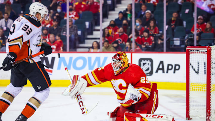 Feb 16, 2022; Calgary, Alberta, CAN; Calgary Flames goaltender Jacob Markstrom (25) makes a save as Anaheim Ducks right wing Jakob Silfverberg (33) tries to score during the second period at Scotiabank Saddledome. Mandatory Credit: Sergei Belski-USA TODAY Sports