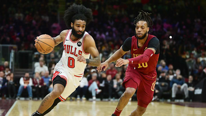Coby White dribbles the basketball