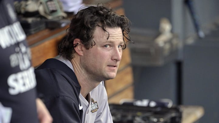 Oct 25, 2024; Los Angeles, California, USA; New York Yankees pitcher Gerrit Cole (45) looks on from the dugout before Game 1 against the Los Angeles Dodgers in the 2024 MLB World Series at Dodger Stadium.