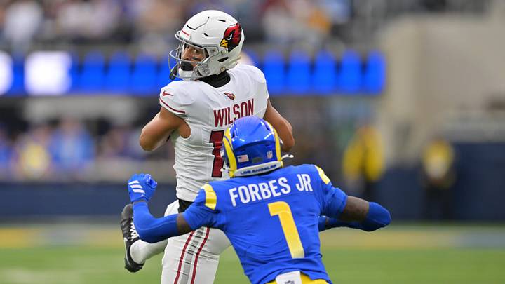 Jan 4, 2026; Inglewood, California, USA; Arizona Cardinals wide receiver Michael Wilson (14) makes the catch in front of Los Angeles Rams cornerback Emmanuel Forbes Jr. (1) during the first half at SoFi Stadium. Mandatory Credit: Jayne Kamin-Oncea-Imagn Images Jan 4, 2026; Inglewood, California, USA; Arizona Cardinals wide receiver Michael Wilson (14) makes the catch in front of Los Angeles Rams cornerback Emmanuel Forbes Jr. (1) during the first half at SoFi Stadium. Mandatory Credit: Jayne Kamin-Oncea-Imagn Images