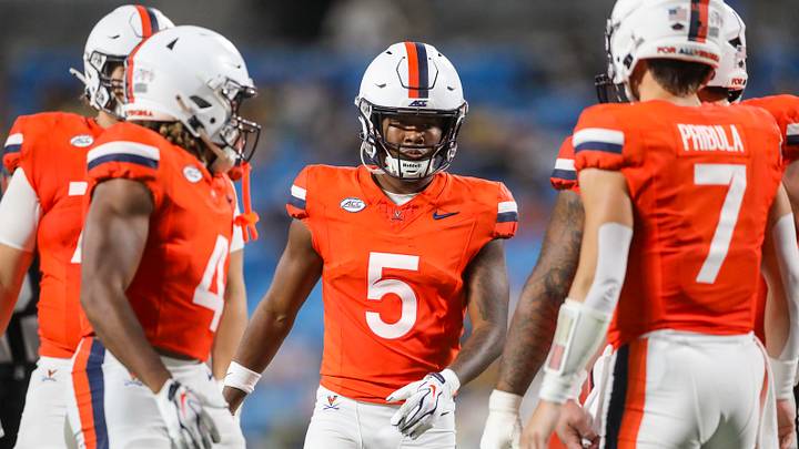Sep 19, 2026; Charlotte, North Carolina, USA; Virginia Cavaliers wide receiver Kameron Courtney (5) stands in the huddle during the second quarter against the West Virginia Mountaineers at Bank of America Stadium. Mandatory Credit: Ben Queen-Imagn Images Sep 19, 2026; Charlotte, North Carolina, USA; Virginia Cavaliers wide receiver Kameron Courtney (5) stands in the huddle during the second quarter against the West Virginia Mountaineers at Bank of America Stadium. Mandatory Credit: Ben Queen-Imagn Images
