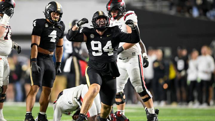 Oct 19, 2024; Nashville, Tennessee, USA; Vanderbilt Commodores defensive lineman Bradley Mann (94) celebrates his sack of Ball State Cardinals defensive back Kiael Kelly (1) during the second half at FirstBank Stadium. Mandatory Credit: Steve Roberts-Imagn Images Oct 19, 2024; Nashville, Tennessee, USA; Vanderbilt Commodores defensive lineman Bradley Mann (94) celebrates his sack of Ball State Cardinals defensive back Kiael Kelly (1) during the second half at FirstBank Stadium. Mandatory Credit: Steve Roberts-Imagn Images