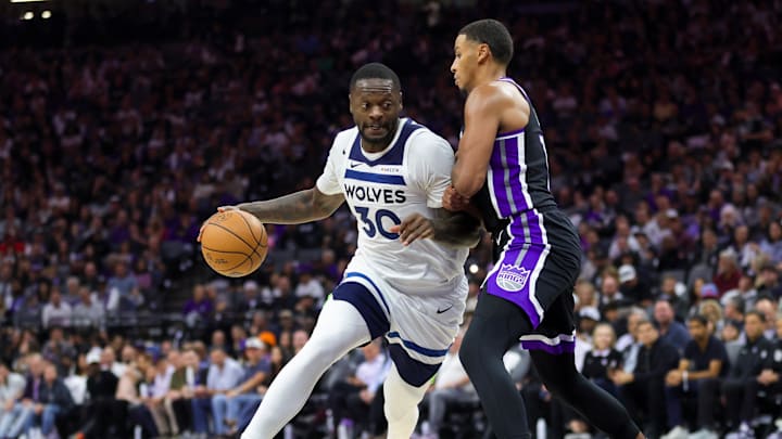 Oct 24, 2024; Sacramento, California, USA; Minnesota Timberwolves forward Julius Randle (30) controls the ball against Sacramento Kings forward Keegan Murray (13) during the third quarter at Golden 1 Center. Mandatory Credit: Sergio Estrada-Imagn Images