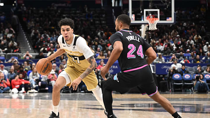Feb 8, 2026; Washington, District of Columbia, USA;  Washington Wizards guard Will Riley (27) attempts to dribble past Miami Heat guard Norman Powell (24) during the third quarter at Capital One Arena. Mandatory Credit: Rafael Suanes-Imagn Images