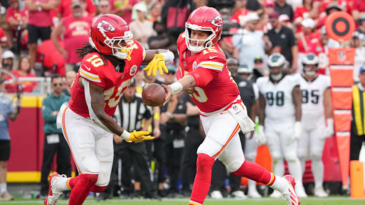 Sep 14, 2025; Kansas City, Missouri, USA; Kansas City Chiefs quarterback Patrick Mahomes (15) hands the ball to running back Isiah Pacheco (10) against the Philadelphia Eagles during the third quarter of the game at GEHA Field at Arrowhead Stadium. Mandatory Credit: Denny Medley-Imagn Images