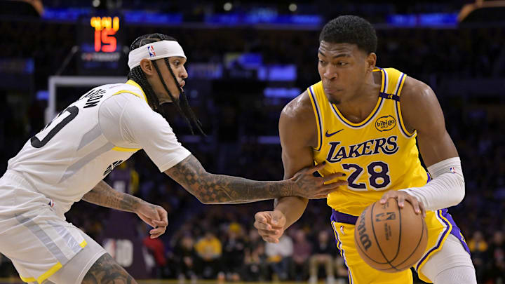 Feb 10, 2025; Los Angeles, California, USA; Los Angeles Lakers forward Rui Hachimura (28) is defended by Utah Jazz guard Jordan Clarkson (00) in the first half at Crypto.com Arena. Mandatory Credit: Jayne Kamin-Oncea-Imagn Images