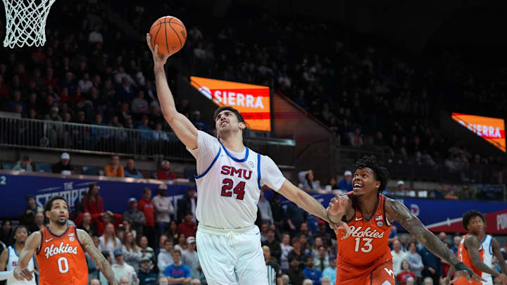 Jan 14, 2026; Dallas, Texas, USA; SMU Mustangs center Samet Yigitoglu (24) grabs the pass in front of Virginia Tech Hokies forward Amani Hansberry (13) during the second half at Moody Coliseum. Mandatory Credit: Raymond Carlin III-Imagn Images Jan 14, 2026; Dallas, Texas, USA; SMU Mustangs center Samet Yigitoglu (24) grabs the pass in front of Virginia Tech Hokies forward Amani Hansberry (13) during the second half at Moody Coliseum. Mandatory Credit: Raymond Carlin III-Imagn Images