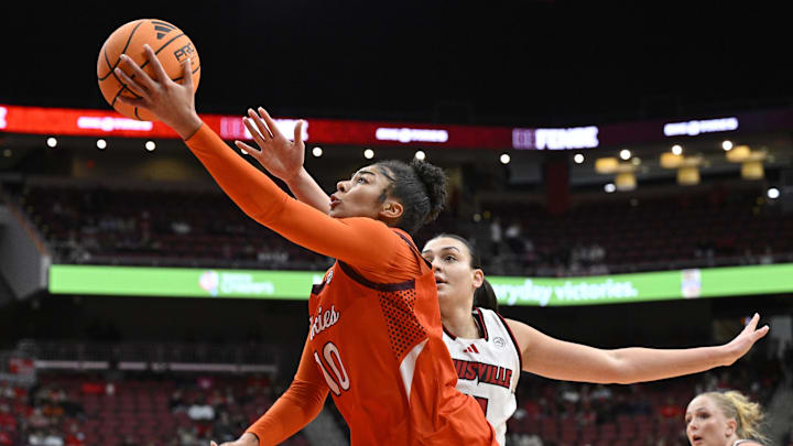 Jan 4, 2026; Louisville, Kentucky, USA; Virginia Tech Hokies forward Carys Baker (10) shoots against Louisville Cardinals forward Elif Istanbulluoglu (11) during the second half at KFC Yum! Center. Louisville defeated Virginia Tech 85-60. Mandatory Credit: Jamie Rhodes-Imagn Images Jan 4, 2026; Louisville, Kentucky, USA; Virginia Tech Hokies forward Carys Baker (10) shoots against Louisville Cardinals forward Elif Istanbulluoglu (11) during the second half at KFC Yum! Center. Louisville defeated Virginia Tech 85-60. Mandatory Credit: Jamie Rhodes-Imagn Images