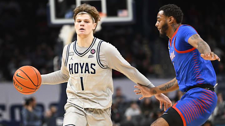Jan 6, 2024; Washington, District of Columbia, USA; Georgetown Hoyas guard Rowan Brumbaugh (1) dribbles as DePaul Blue Demons guard Chico Carter Jr. (2) defends during the first half at Capital One Arena. 