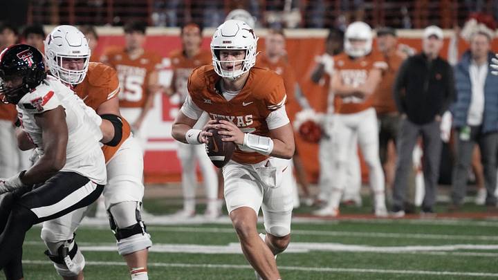 Texas Longhorns quarterback Arch Manning looks to pass the ball during the second half against the Texas Tech Red Raiders at Darrell K Royal-Texas Memorial Stadium.