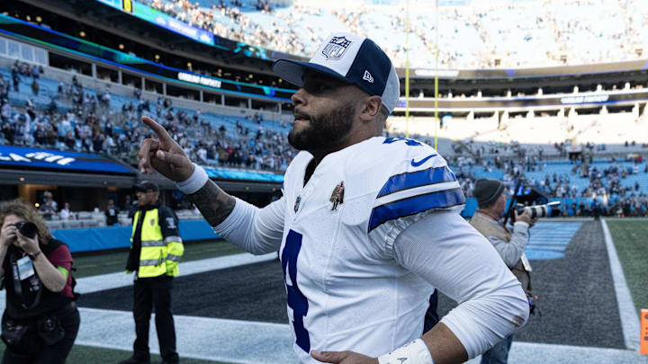 Dallas Cowboys quarterback Dak Prescott runs off the field after the game at Bank of America Stadium. 