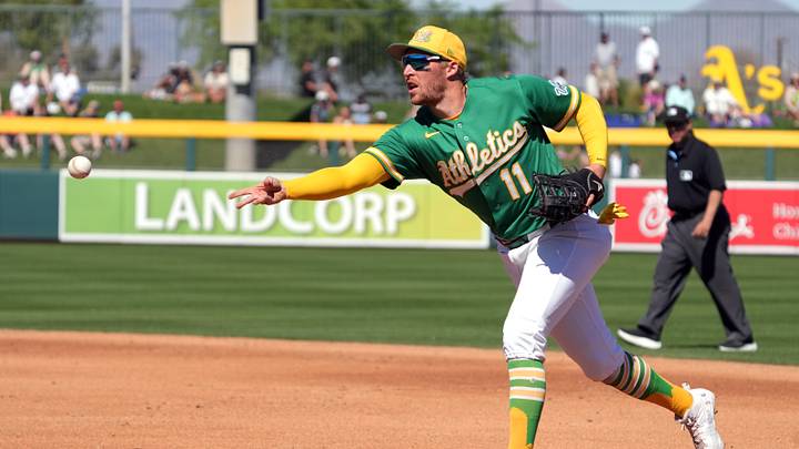Mar 6, 2026; Mesa, Arizona, USA; Athletics third baseman Brett Harris (11) makes the play for an out against the Colorado Rockies in the second inning at Hohokam Stadium. Mandatory Credit: Rick Scuteri-Imagn Images Mar 6, 2026; Mesa, Arizona, USA; Athletics third baseman Brett Harris (11) makes the play for an out against the Colorado Rockies in the second inning at Hohokam Stadium. Mandatory Credit: Rick Scuteri-Imagn Images