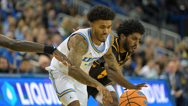 Dec 17, 2025; Los Angeles, California, USA; UCLA Bruins guard Donovan Dent (2) is defended by Arizona State Sun Devils guard Moe Odum (5) as he drives to the basket in the first half at Pauley Pavilion presented by Wescom Financial. Mandatory Credit: Jayne Kamin-Oncea-Imagn Images Dec 17, 2025; Los Angeles, California, USA; UCLA Bruins guard Donovan Dent (2) is defended by Arizona State Sun Devils guard Moe Odum (5) as he drives to the basket in the first half at Pauley Pavilion presented by Wescom Financial. Mandatory Credit: Jayne Kamin-Oncea-Imagn Images
