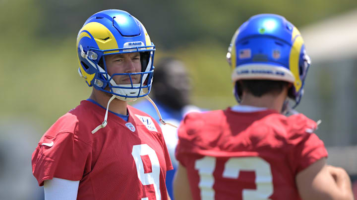 May 28, 2024; Thousand Oaks, CA, USA;  Los Angeles Rams quarterbacks Matthew Stafford (9) and Stetson Bennett (13) participate in drills during OTAs at California Lutheran University. Mandatory Credit: Jayne Kamin-Oncea-USA TODAY Sports
