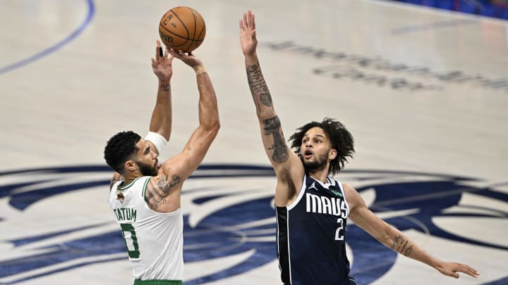 Jun 12, 2024; Dallas, Texas, USA; Boston Celtics forward Jayson Tatum (0) shoots against Dallas Mavericks center Dereck Lively II (2) during the first quarter in game three of the 2024 NBA Finals at American Airlines Center. Mandatory Credit: Jerome Miron-USA TODAY Sports Jun 12, 2024; Dallas, Texas, USA; Boston Celtics forward Jayson Tatum (0) shoots against Dallas Mavericks center Dereck Lively II (2) during the first quarter in game three of the 2024 NBA Finals at American Airlines Center. Mandatory Credit: Jerome Miron-USA TODAY Sports
