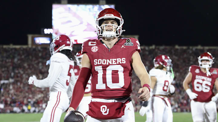 Dec 19, 2025; Norman, OK, USA; Oklahoma Sooners quarterback John Mateer (10) celebrates scoring a touchdown in the first half against the Alabama Crimson Tide at Gaylord Family OK Mem. Stadiu. Mandatory Credit: Nelson Chenault-Imagn Images