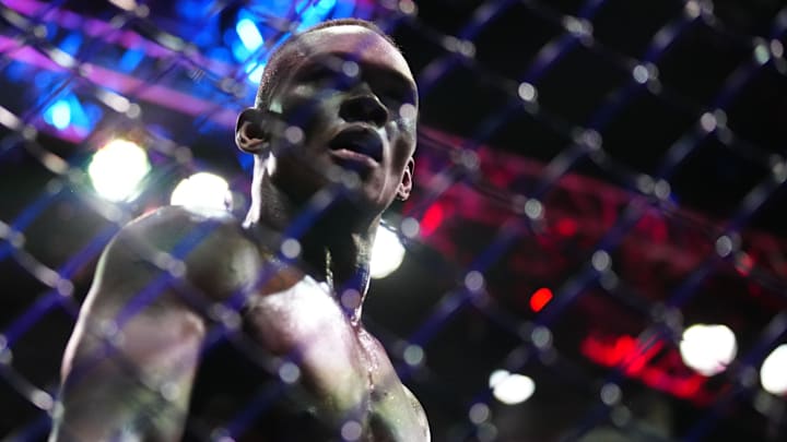 Apr 8, 2023; Miami, Florida, USA; Israel Adesanya (blue gloves) reacts to defeating Alex Pereira