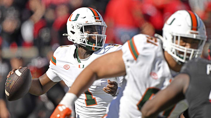 Oct 19, 2024; Louisville, Kentucky, USA; Miami Hurricanes quarterback Cam Ward (1) looks to pass against the Louisville Cardinals during the first half at L&N Federal Credit Union Stadium. Miami defeated Louisville 52-45. Mandatory Credit: Jamie Rhodes-Imagn Images Oct 19, 2024; Louisville, Kentucky, USA; Miami Hurricanes quarterback Cam Ward (1) looks to pass against the Louisville Cardinals during the first half at L&N Federal Credit Union Stadium. Miami defeated Louisville 52-45. Mandatory Credit: Jamie Rhodes-Imagn Images