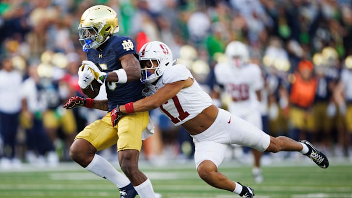 Stanford cornerback Jshawn Frausto-Ramos (17) tackles Notre Dame wide receiver Beaux Collins (5) during a NCAA college football game between Notre Dame and Stanford at Notre Dame Stadium on Saturday, Oct. 12, 2024, in South Bend.