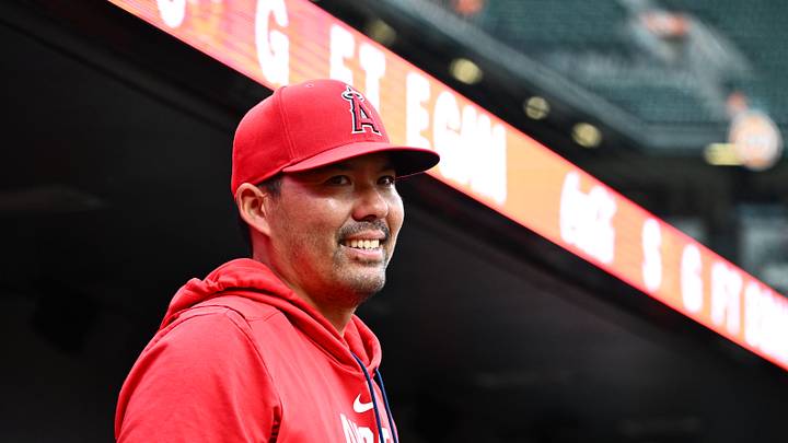 Baltimore, Maryland, USA; Los Angeles Angels manager Kurt Suzuki (8) stands in the dugout during the first inning against the Baltimore Orioles at Oriole Park at Camden Yards. Mandatory Credit: James A. Pittman-Imagn Images