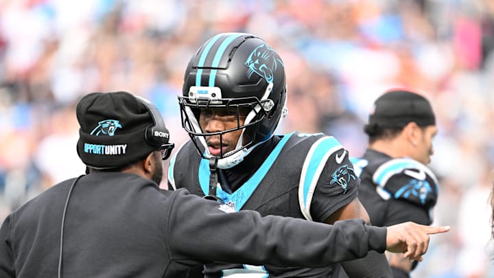 Dec 21, 2025; Charlotte, North Carolina, USA; Carolina Panthers cornerback Mike Jackson (2) talks to an assistant coach in the second quarter at Bank of America Stadium. Mandatory Credit: Bob Donnan-Imagn Images