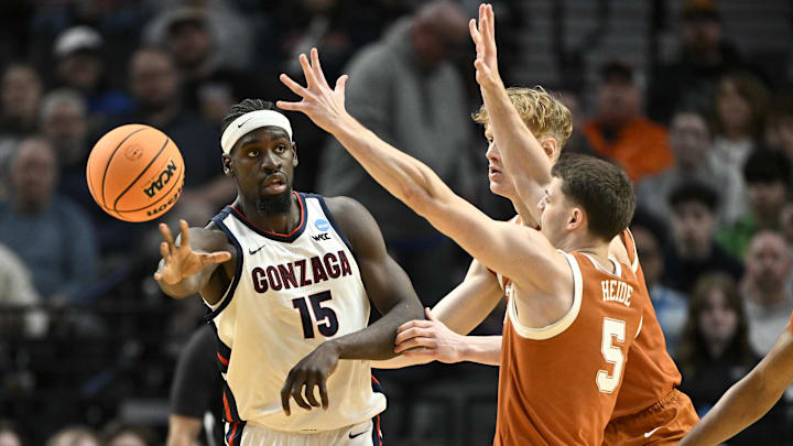 Mar 21, 2026; Portland, OR, USA; Gonzaga Bulldogs forward Graham Ike (15) passes against Texas Longhorns forward Camden Heide (5) in the first half during a second round game of the men's 2026 NCAA Tournament at Moda Center. 