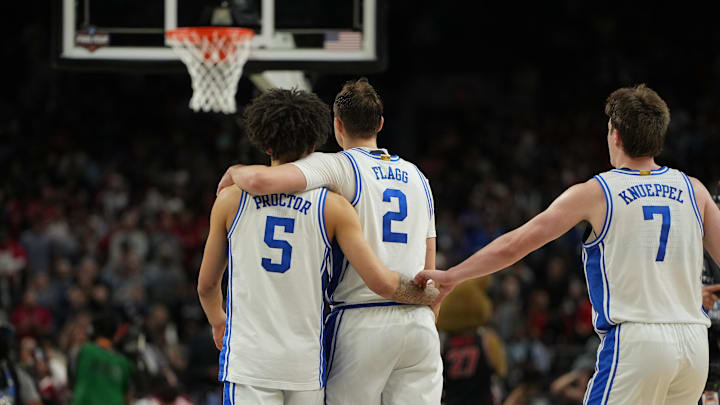 Apr 5, 2025; San Antonio, TX, USA; Duke Blue Devils guard Tyrese Proctor (5), forward Cooper Flagg (2), and guard Kon Knueppel (7) console each other late in the second half in the semifinals of the men's Final Four of the 2025 NCAA Tournament at the Alamodome. Mandatory Credit: Bob Donnan-Imagn Images