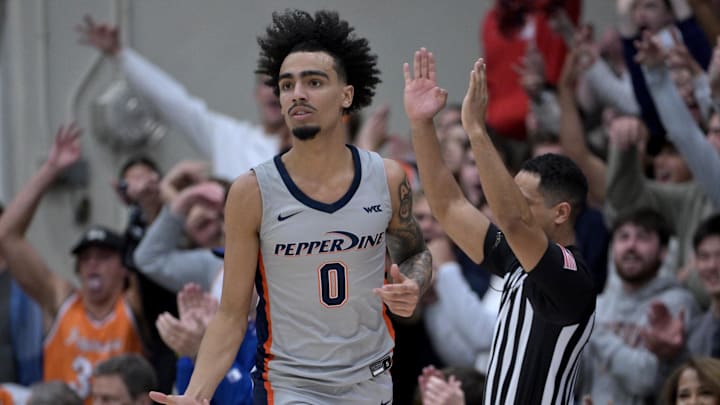 Jan 18, 2024; Malibu, California, USA; Pepperdine Waves guard Houston Mallette (0) heads down court after a 3-point basket in the first half at Firestone Fieldhouse. Mandatory Credit: Jayne Kamin-Oncea-Imagn Images