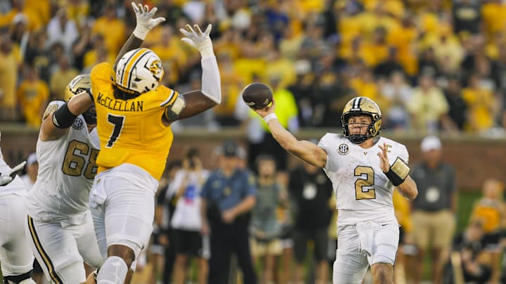 Sep 21, 2024; Columbia, Missouri, USA; Missouri Tigers wide receiver Marquis Johnson (2) throws a pass against Missouri Tigers defensive tackle Chris McClellan (7) during the second half at Faurot Field at Memorial Stadium. Mandatory Credit: Jay Biggerstaff-Imagn Images