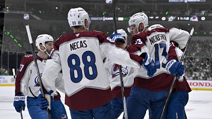 Apr 21, 2025; Dallas, Texas, USA; Colorado Avalanche left wing Jonathan Drouin (27) and center Martin Necas (88) and right wing Valeri Nichushkin (13) and center Nathan MacKinnon (29) celebrates a a power-play goal scored by MacKinnon against the Dallas Stars during the first period in game two of the first round of the 2025 Stanley Cup Playoffs at American Airlines Center. Mandatory Credit: Jerome Miron-Imagn Images